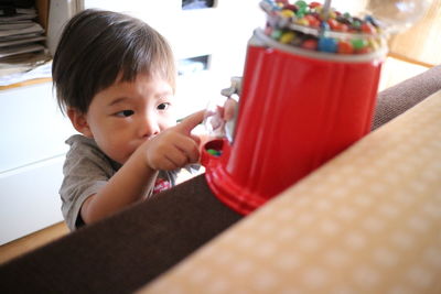 Boy with candy at home