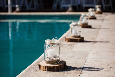 High angle view jars on poolside