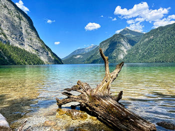 Scenic view of sea and mountains against sky