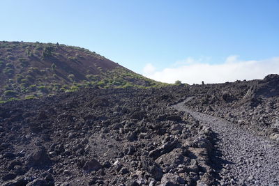 Low angle view of rock formations against sky