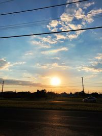 Scenic view of field against sky during sunset