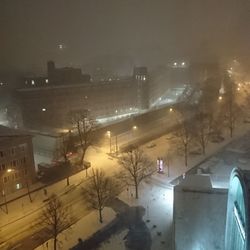 Illuminated city at night during winter