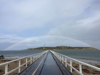 Pier over sea against sky