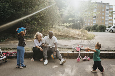 Family with daughters spending time actively outdoors