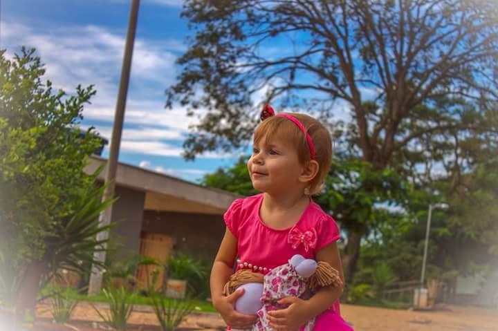 GIRL STANDING OUTDOORS