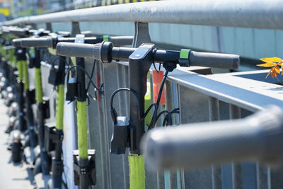 Close-up of bicycle on railing in city