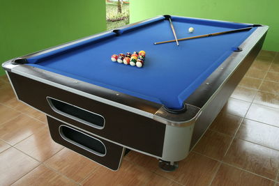 Pool table on hardwood floor