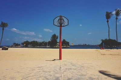 Scenic view of beach against blue sky