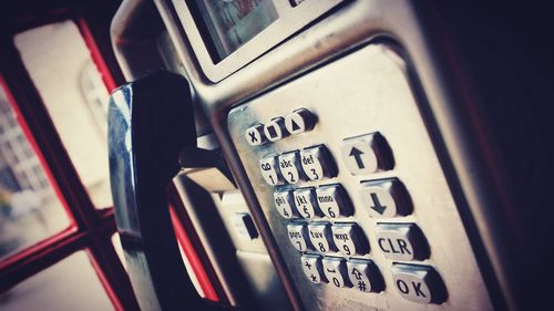 Tilt image of telephone in booth