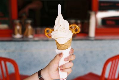 Hand holding ice cream cone