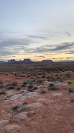 Scenic view of desert against sky during sunset