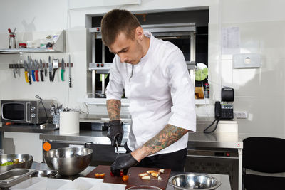 Man preparing food in kitchen