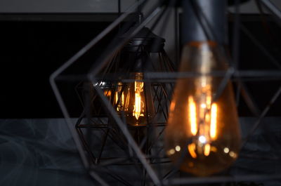 Close-up of illuminated light bulbs on table