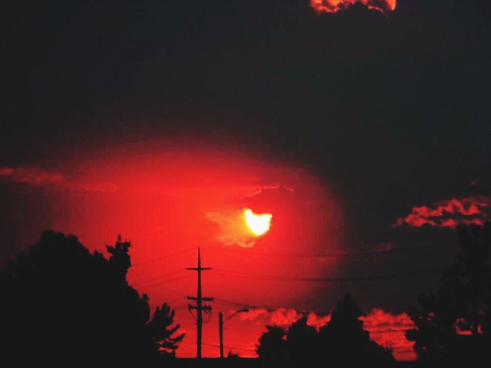 sunset, silhouette, orange color, sky, beauty in nature, tree, scenics, tranquility, low angle view, tranquil scene, nature, idyllic, dramatic sky, red, power line, cloud - sky, outdoors, dusk, no people, growth