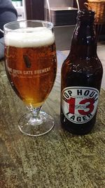 Close-up of beer glass on table