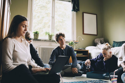 People sitting on table at home