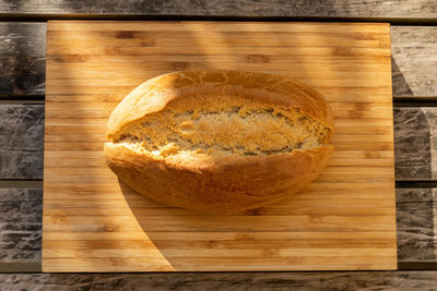 High angle view of bread on cutting board