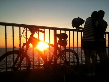 Silhouette of people at sunset