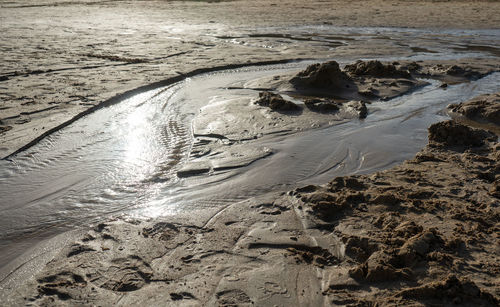 High angle view of wet sand on beach