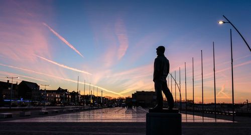 Silhouette of woman at dusk