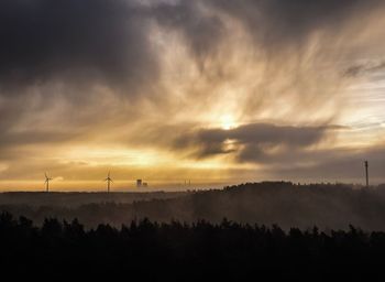 Scenic view of silhouette landscape against sky during sunset