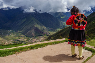 Girl standing on mountain