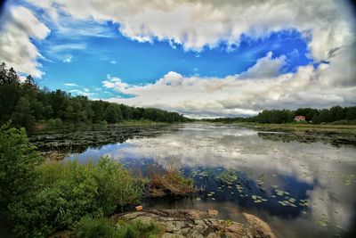Scenic view of sea against cloudy sky