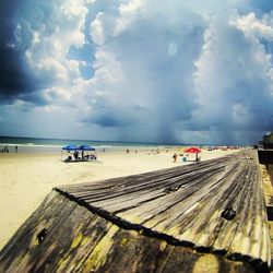 Scenic view of sea against cloudy sky