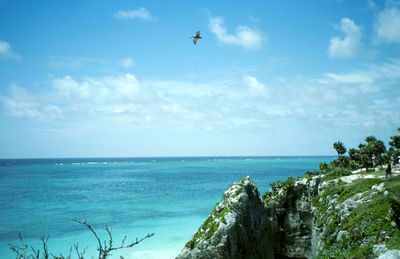 Scenic view of sea against cloudy sky