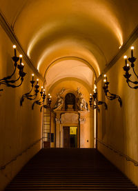 Low angle view of illuminated corridor