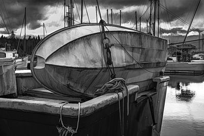 View of fishing boats moored at harbor