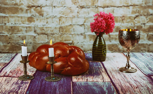 Close-up of wineglass on table against wall