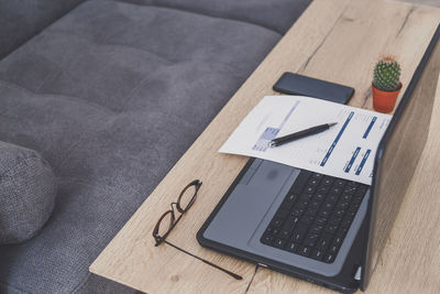 High angle view of laptop on table at home