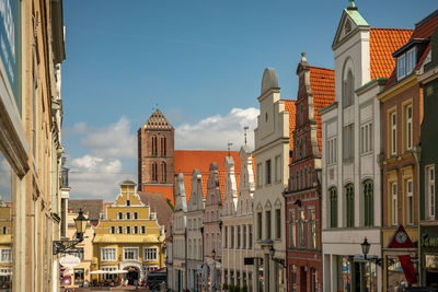 Low angle view of buildings in city against sky