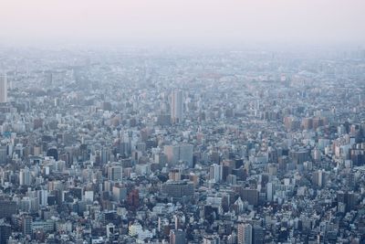 High angle view of buildings in city against sky