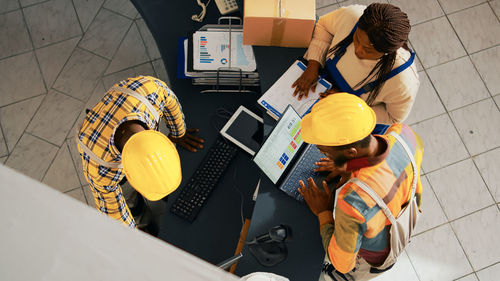 High angle view of man working on table