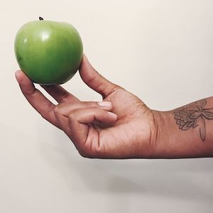 Close-up of hand holding fruit