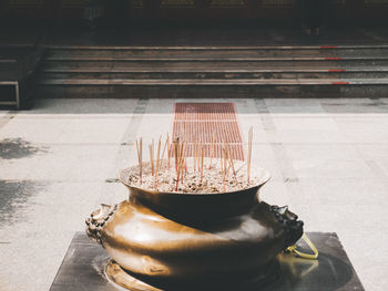 Incense in container at temple