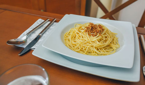 High angle view of noodles in plate on table