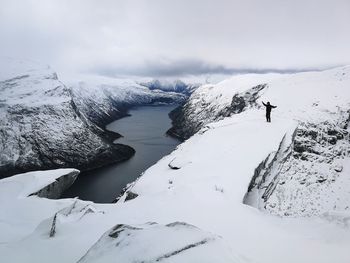 Scenic view of snow covered mountain against sky