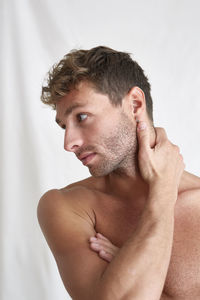 Portrait of young man looking away