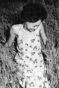 High angle view of woman lying on field