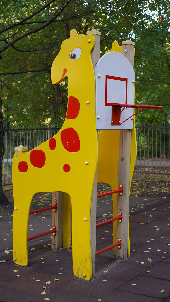 CLOSE-UP OF PLAYGROUND AGAINST CLEAR SKY AT PARK