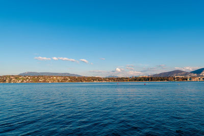 Scenic view of sea against blue sky