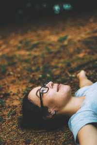 Smiling woman lying on land