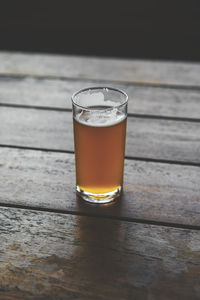 Close-up of beer glass on table