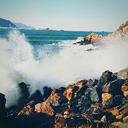 Waves splashing on rocks