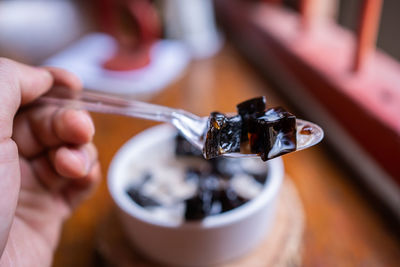 Close-up of hand holding ice cream