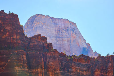 Low angle view of rock formations against clear sky