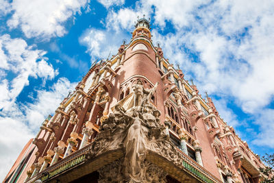 Low angle view of temple building against cloudy sky